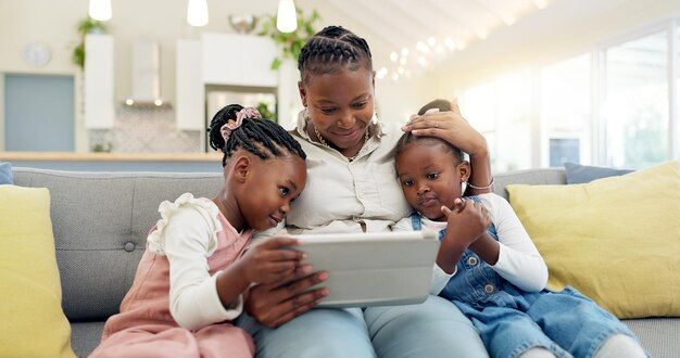 A parent guiding a child using a tablet at home