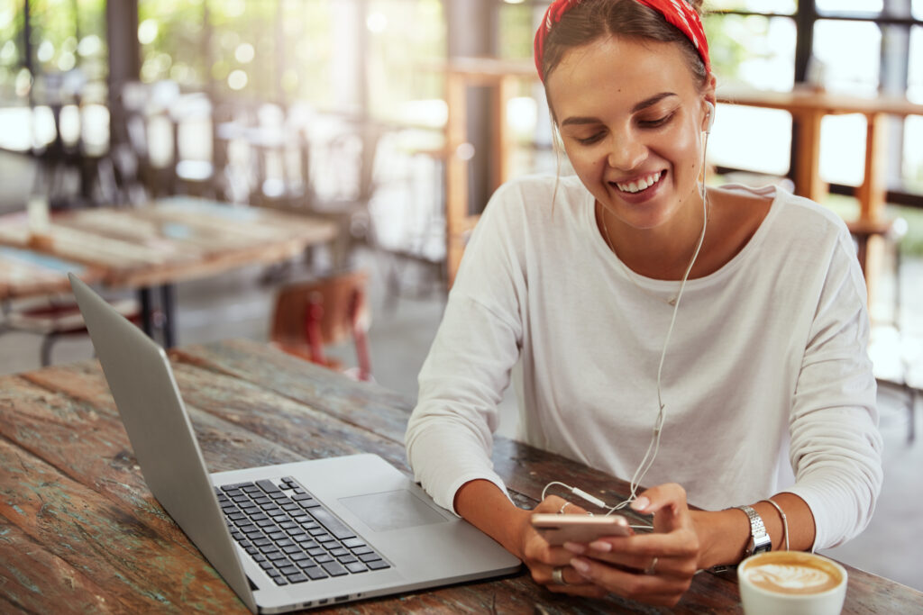  Person working on laptop and mobile device seamlessly