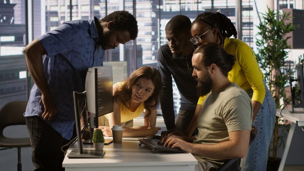  Team collaborating on cloud-based software dashboard