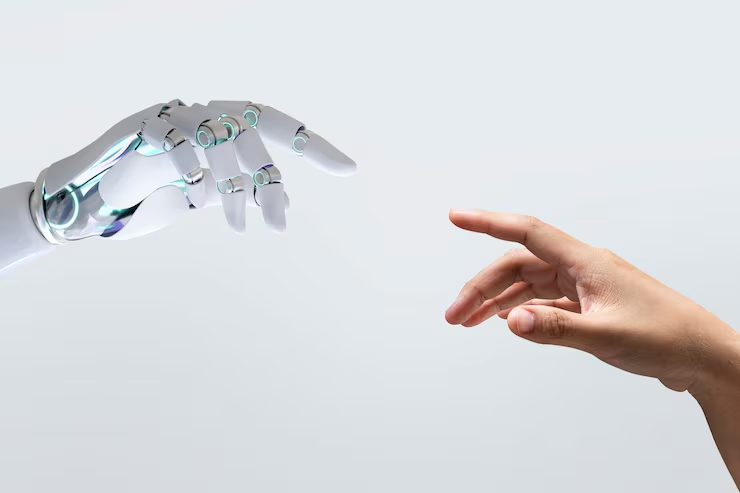 Split image of a robot hand and a human hand typing on the same keyboard