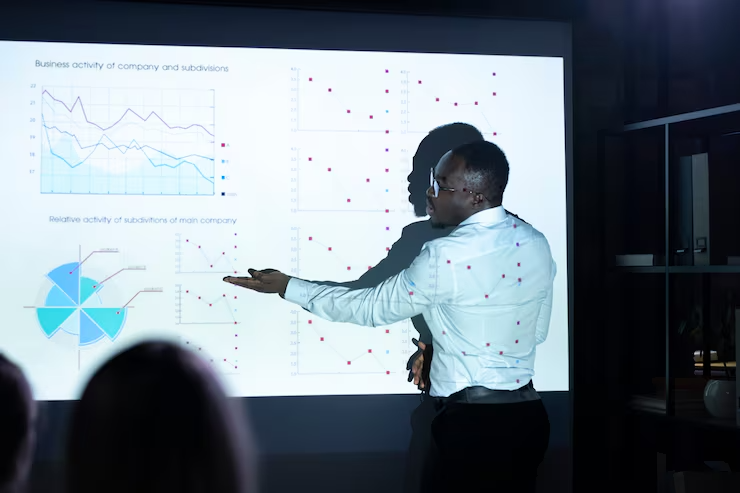 Human working on a whiteboard while AI tracks data analytics