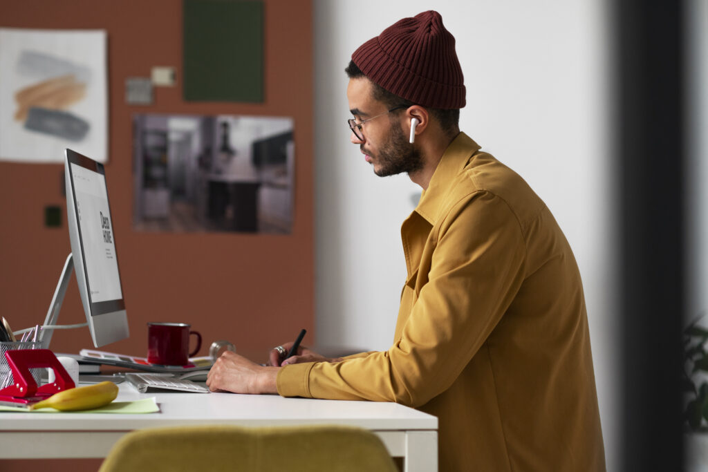 Remote worker desk set up with AI software interfaces